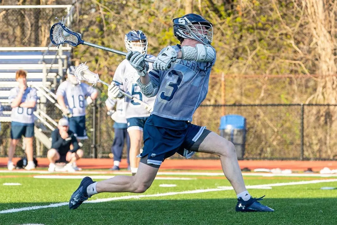 Staples (Conn.) boys' lacrosse player Ben Burmeister in action