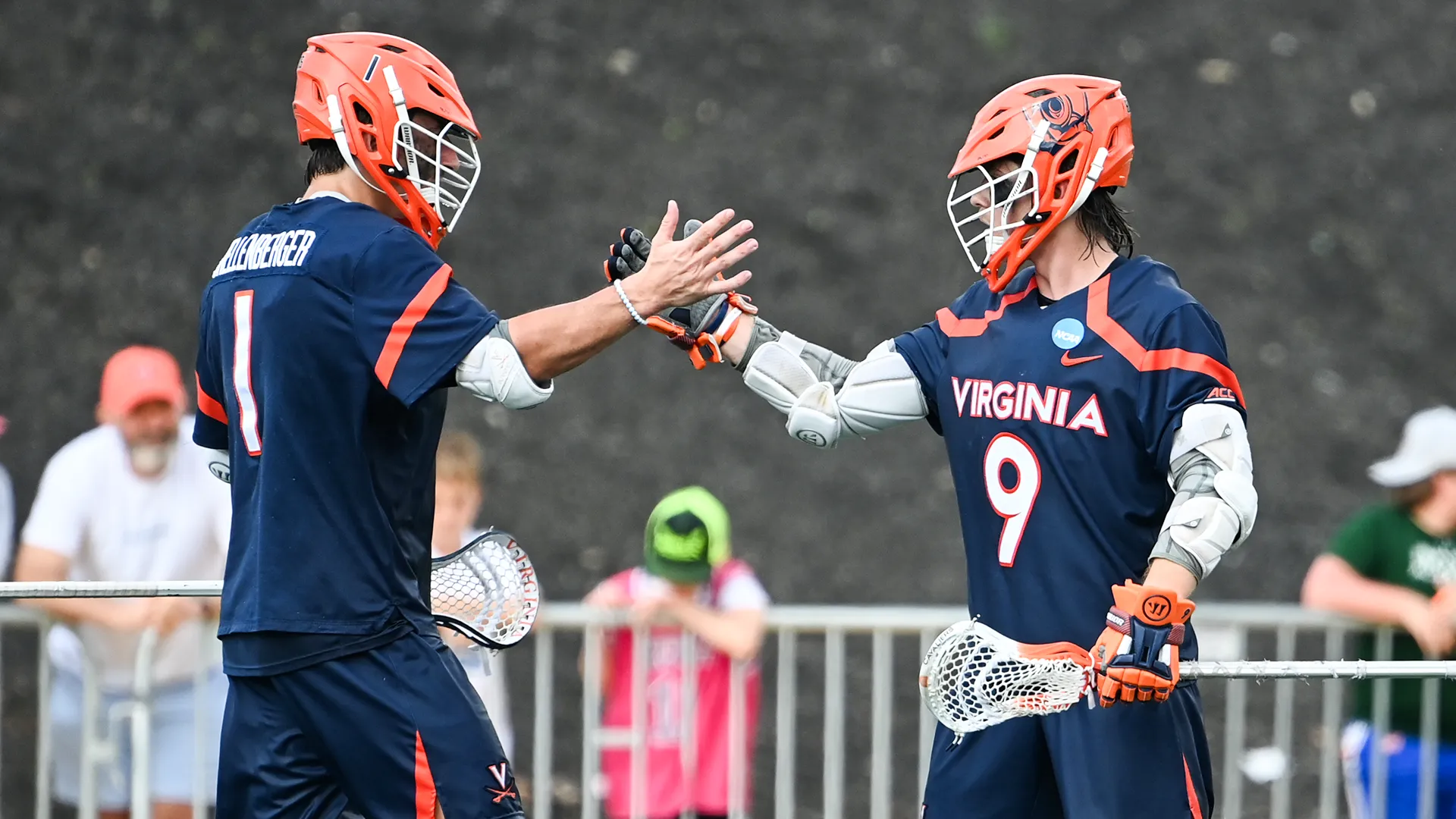 Virginia lacrosse stars Connor Shellenberger (1) and McCabe Millon (9) shake hands.
