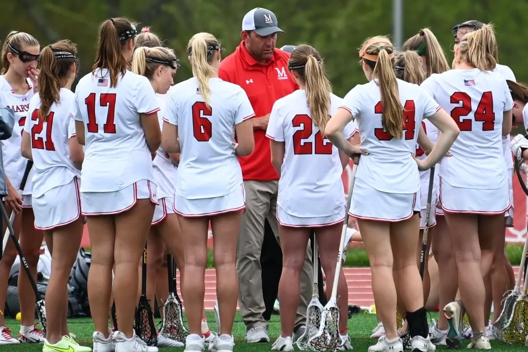 Coach in team huddle