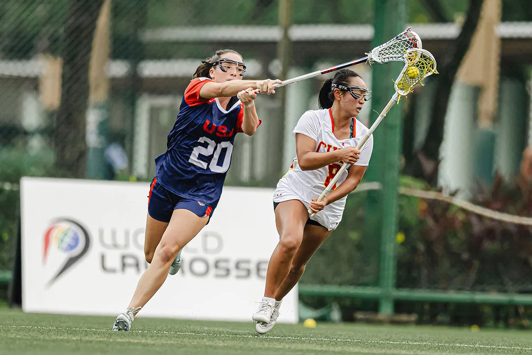 USA defender Grace Callahan applies pressure against China in U20 women's lacrosse world championship tournament.