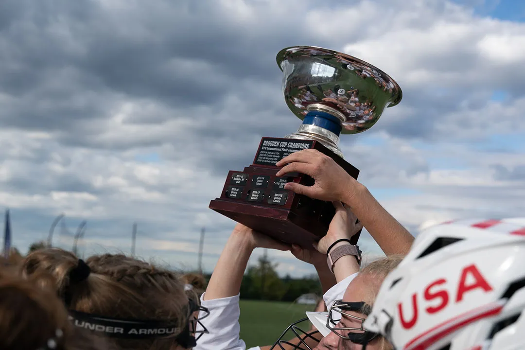 Players hold up the Brogden Cup trophy