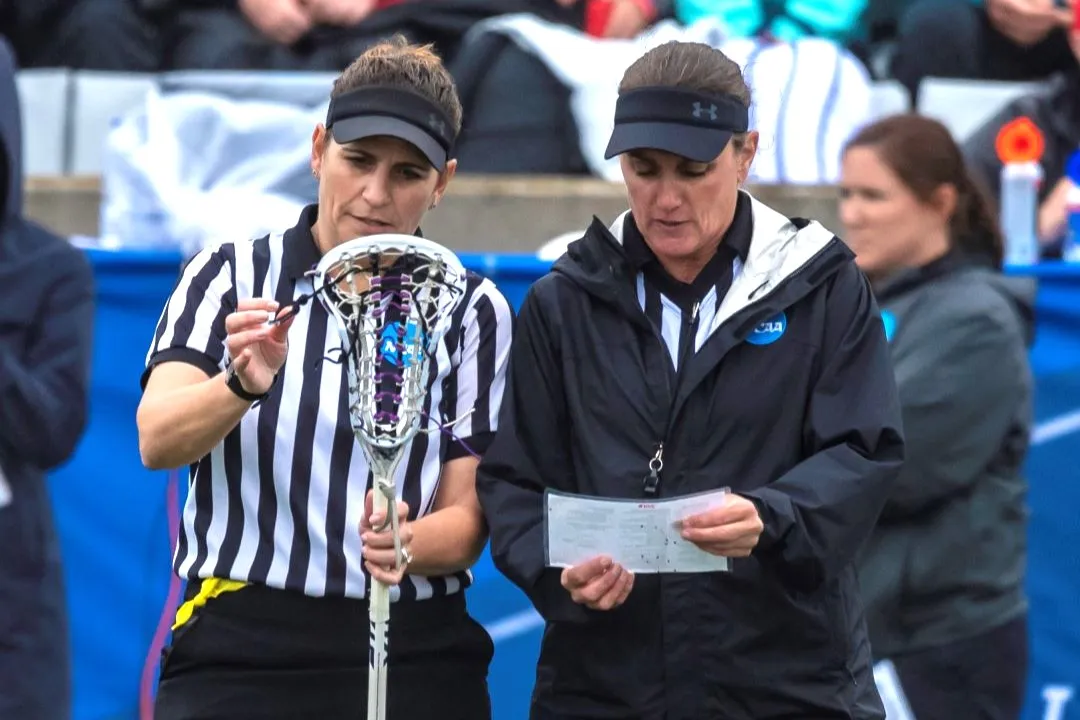 Officials reviewing stick