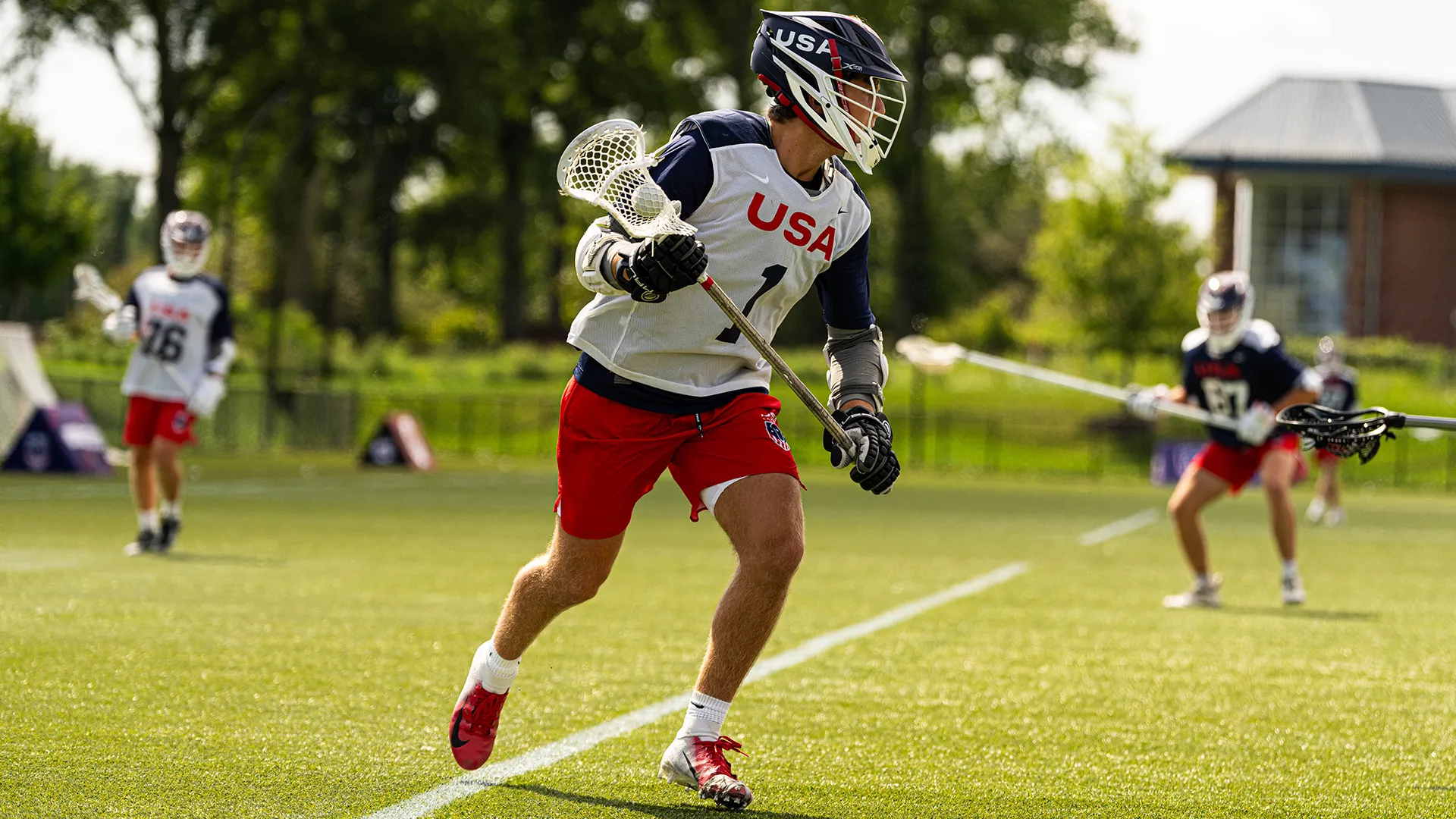 Timothy Shannehan runs with a lacrosse stick and ball