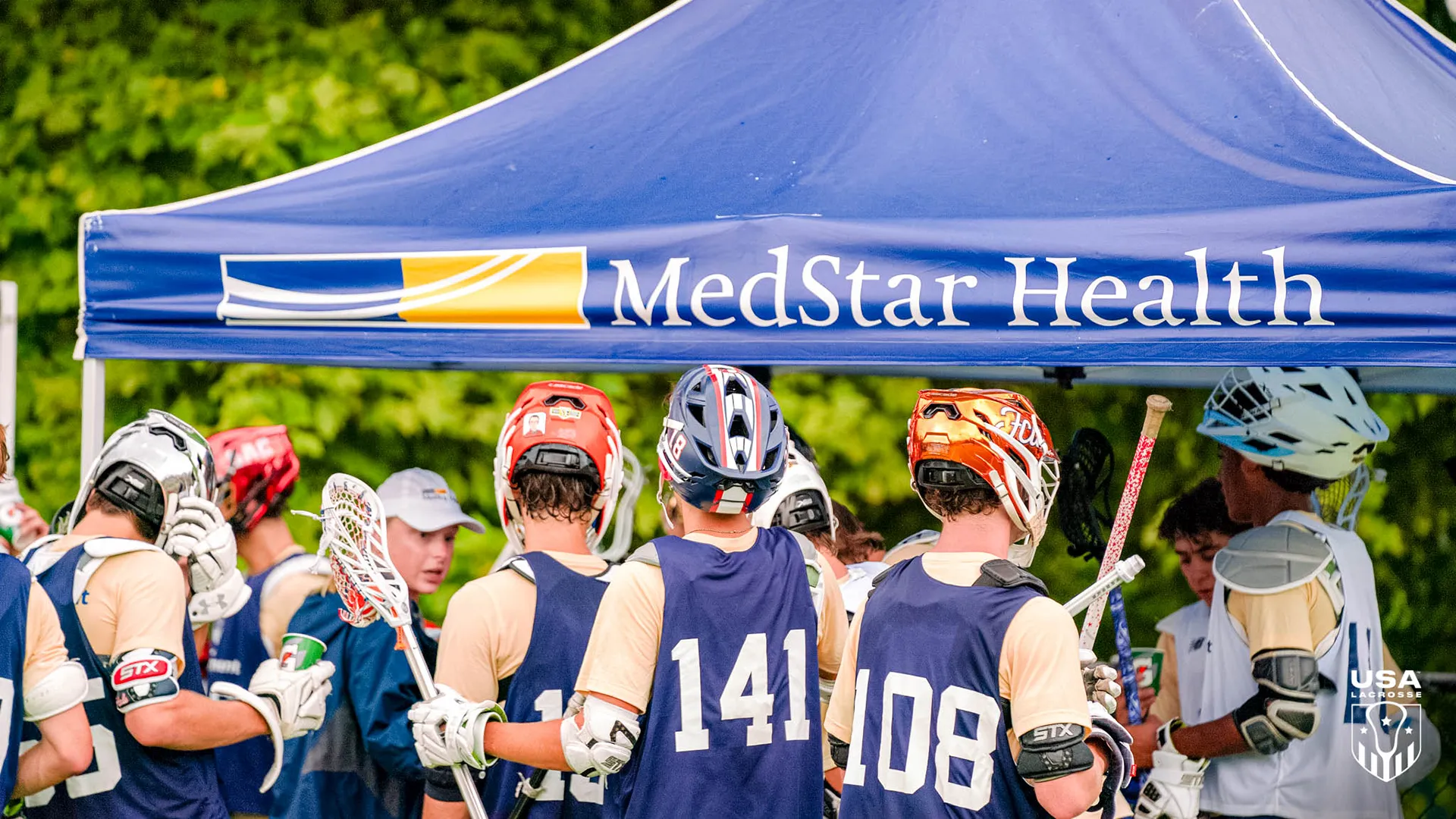 USA Lacrosse National Team Development Program athletes hydrate under a MedStar Health tent