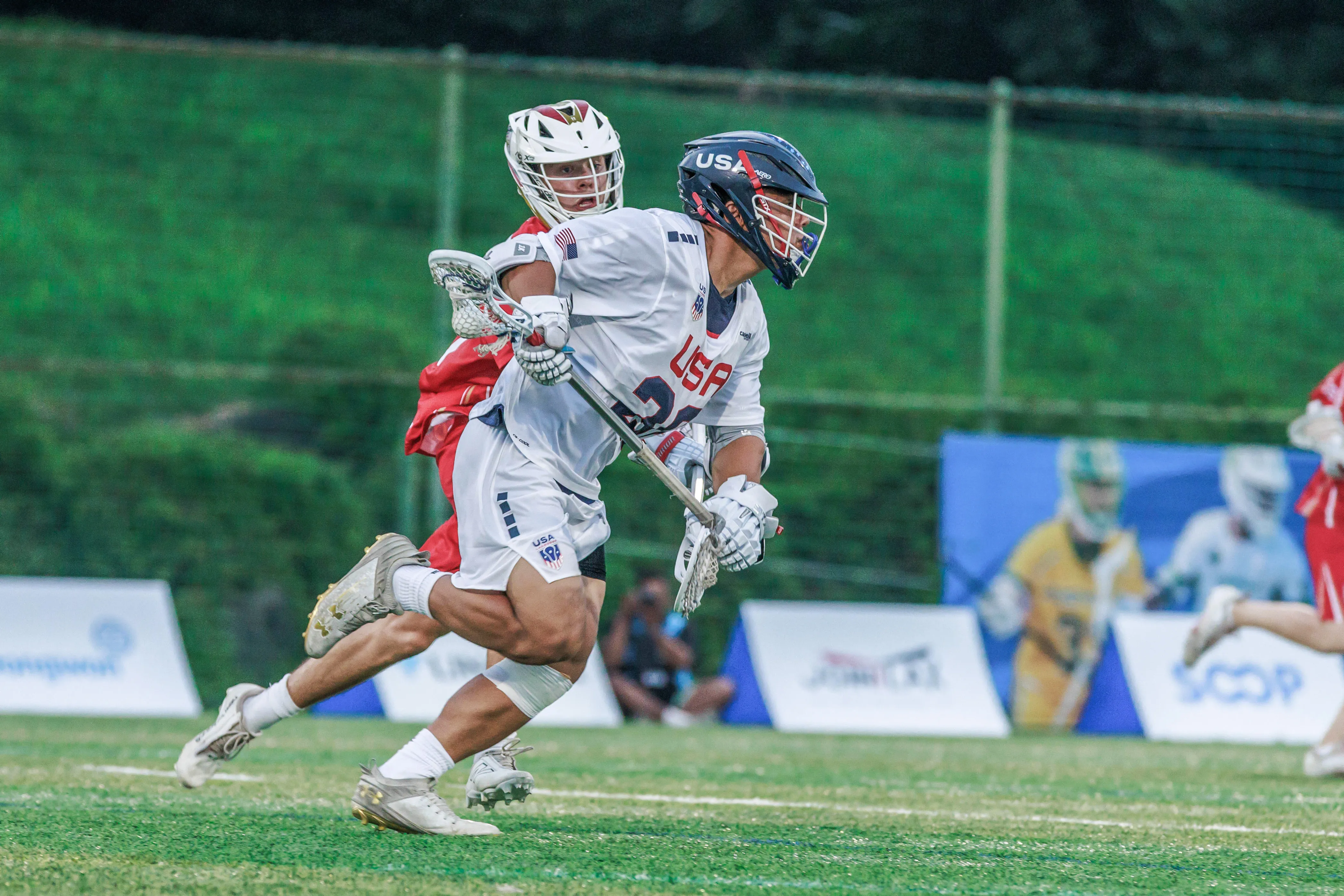Zach Hayashi controls the possession in the World Lacrosse Men's U20 Championship quarterfinals.
