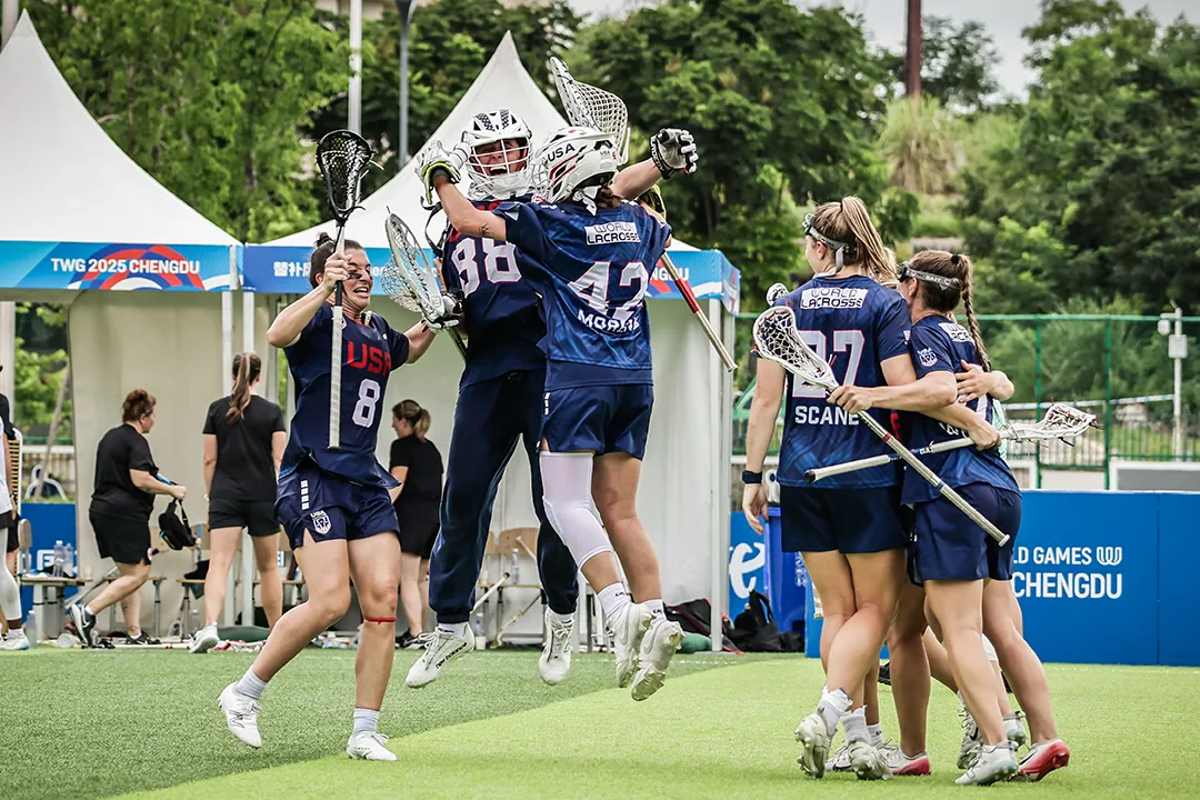 USA goalies Shea Dolce and Taylor Moreno leap high as the team celebrates its win over Canada in The World Games final