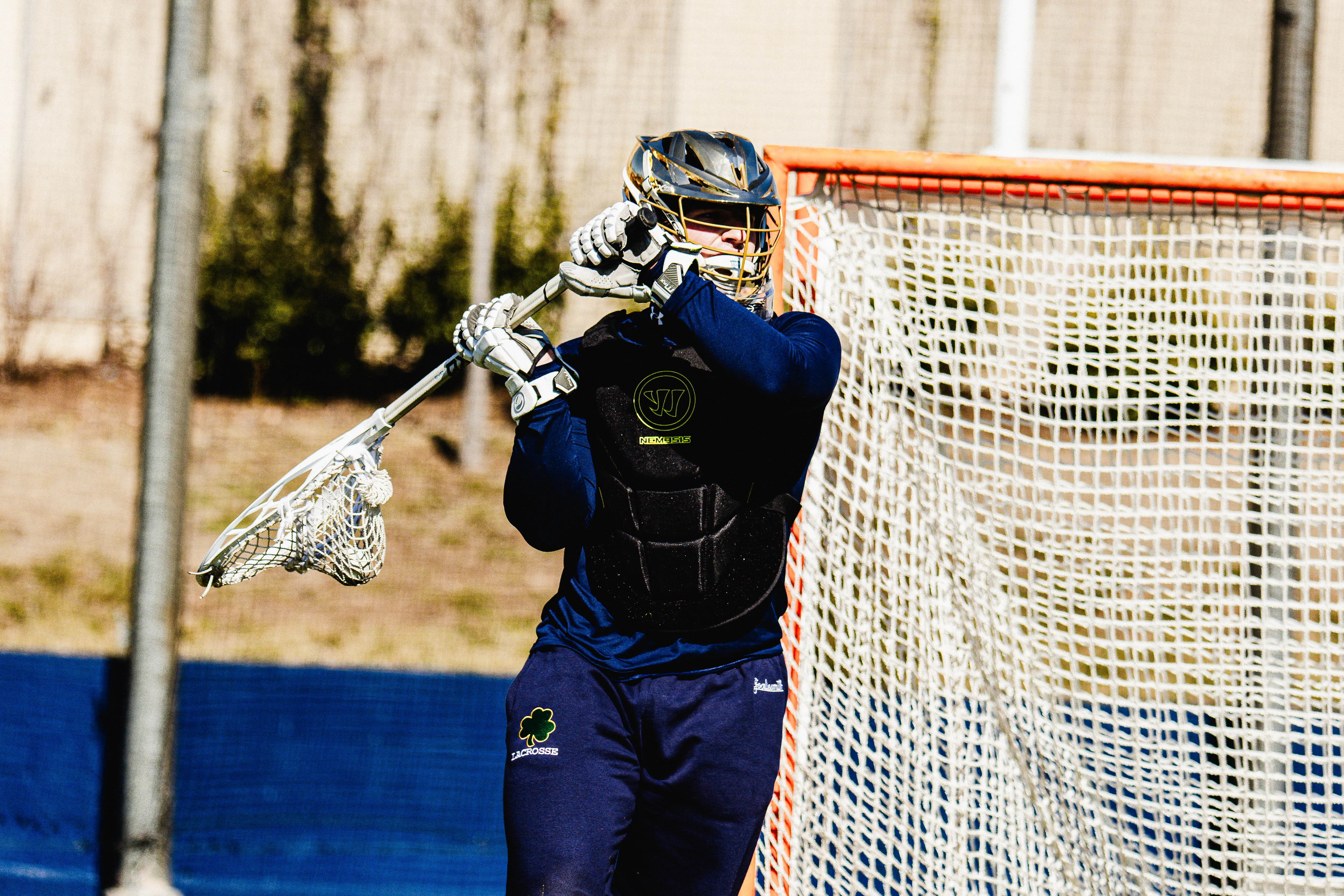Image of Notre Dame lacrosse goalie throwing an outlet pass