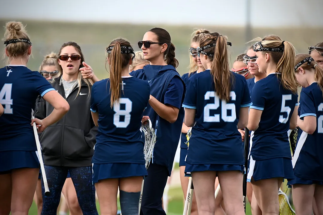 Sam Geiersbach gives instructions to her Valor Christian girls lacrosse team