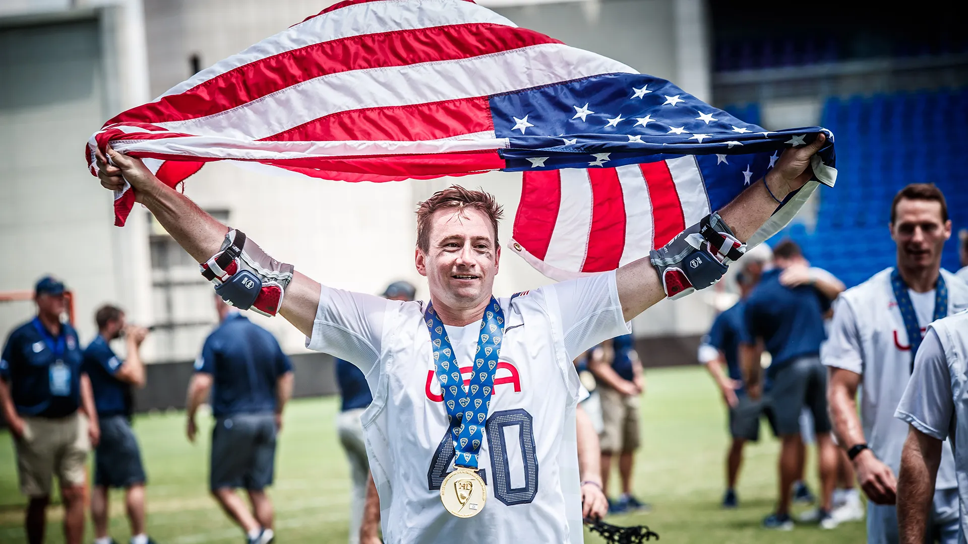 Matt Danowski holds the American flag above his head after helping the U.S. win the 2018 World Lacrosse championship