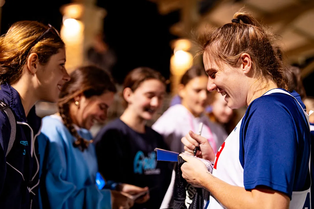 Izzy Scane signs autographs following a U.S. women's training camp in Round Rock, Texas
