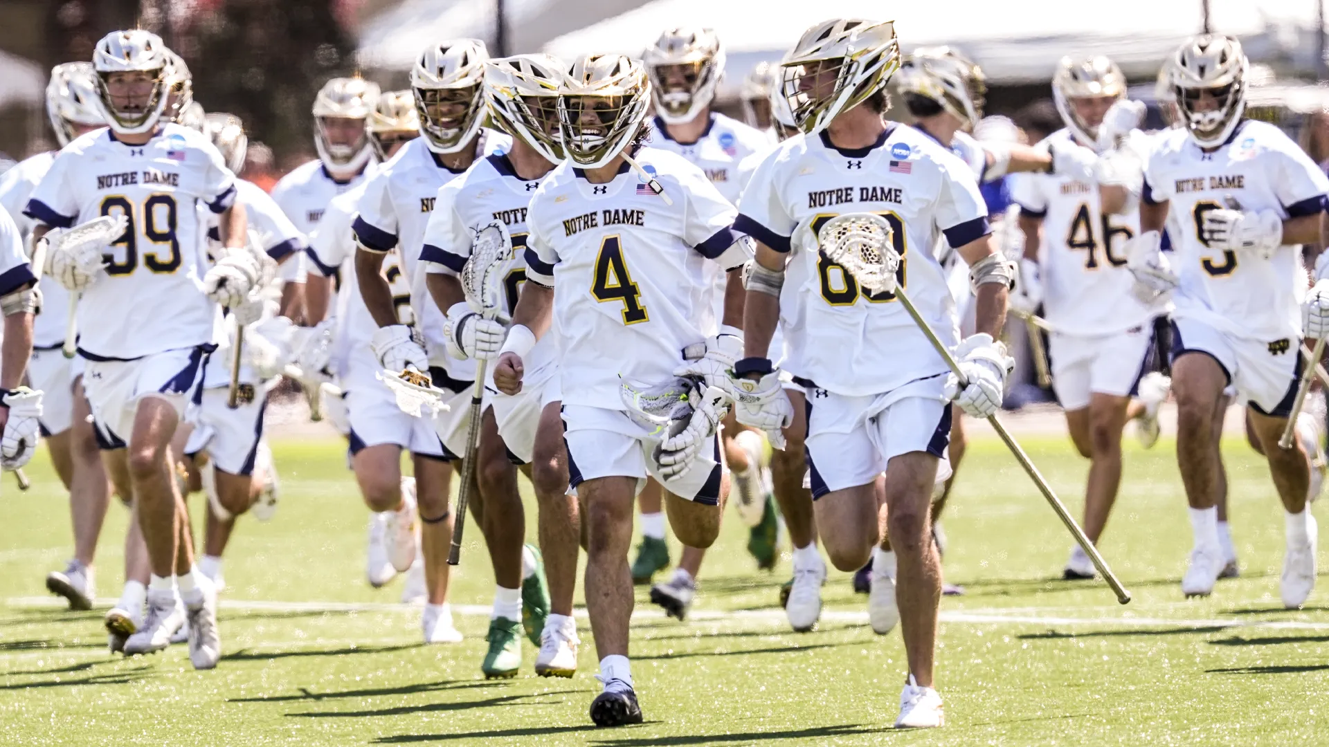 Matt Jeffery (4) leads a team celebration after Notre Dame's NCAA quarterfinal victory over Johns Hopkins at Hofstra