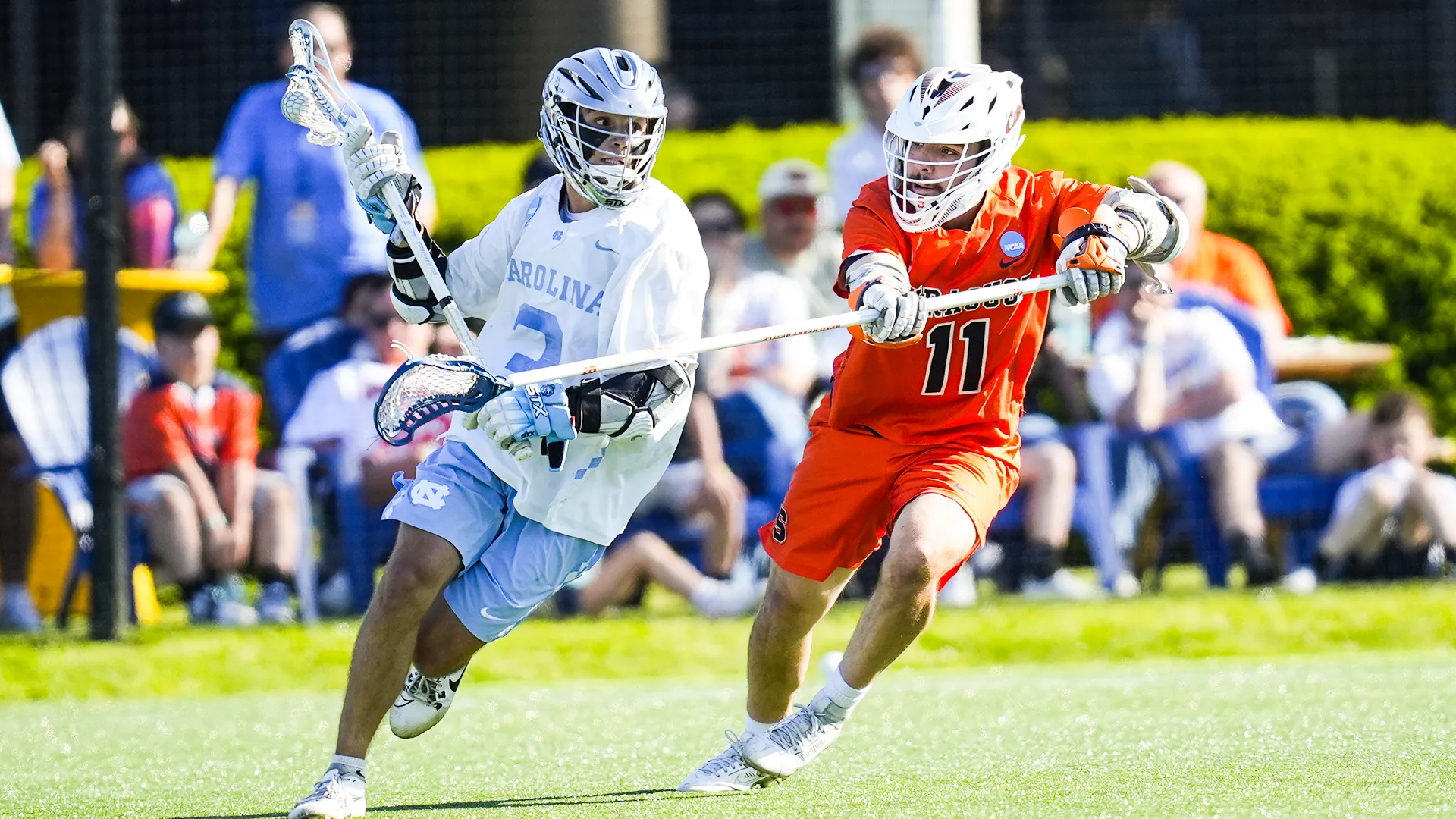 Syracuse defenseman Riley Figueiras with a V-hold on North Carolina attackman Brevin Wilson during the NCAA quarterfinals at Hofstra