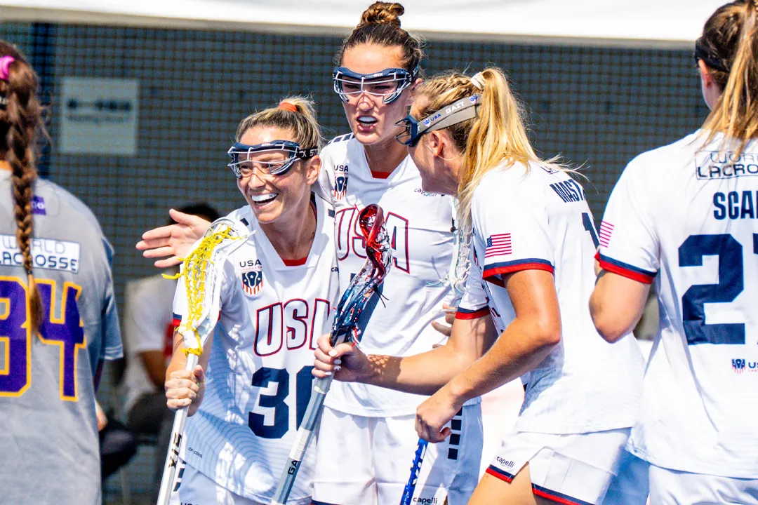 Ally Kennedy, Eliza OSburn and Ally Mastroianni get together to celebrate a goal, one of 22 in USA's 22-5 win over the Haudenosaunee at the World Lacrosse Women's Championship in Tokyo, Japan.