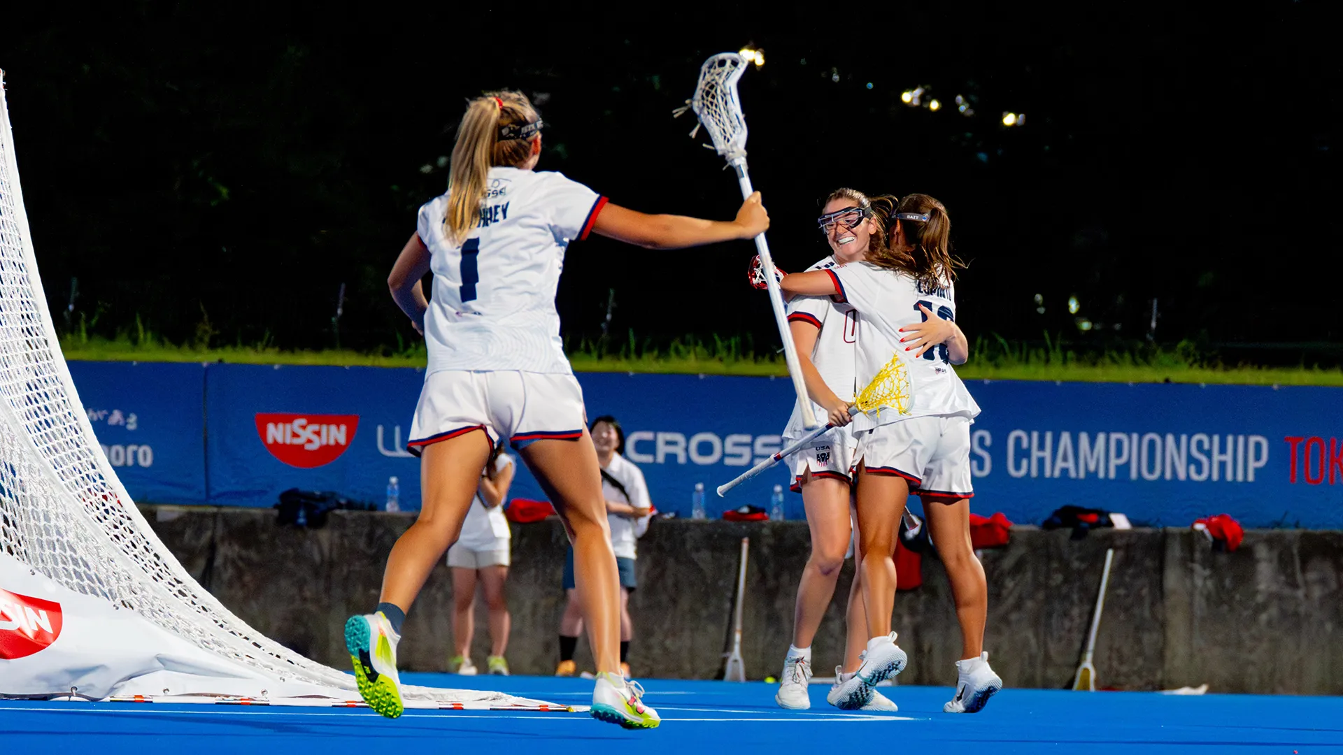 chloe humphrey runs towards sam apuzzo and emma lopinto after a usa goal