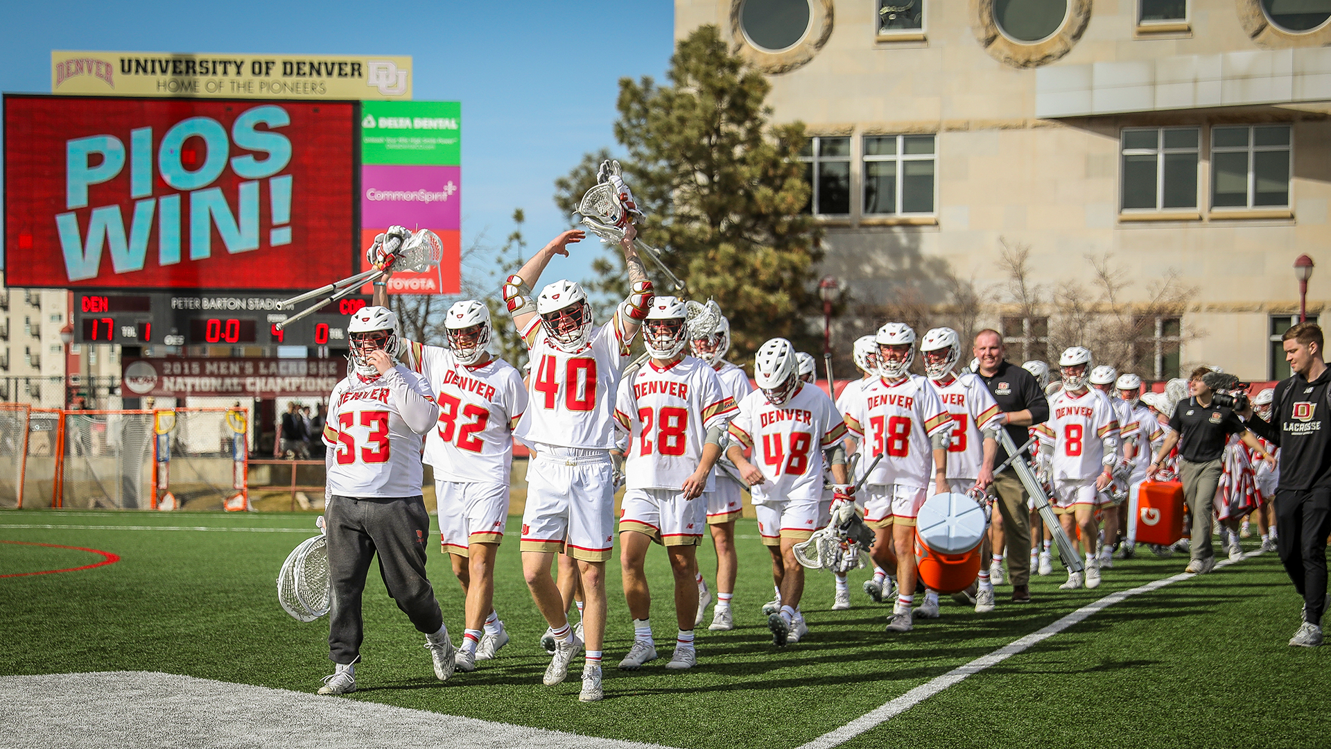 Denver celebrates following its 17-16 victory over Cornell at Peter Barton Lacrosse Stadium.
