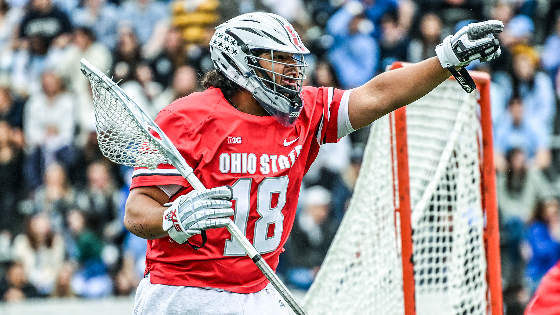 Ohio State lacrosse goalie Caleb Fyock directs traffic during a game at Johns Hopkins
