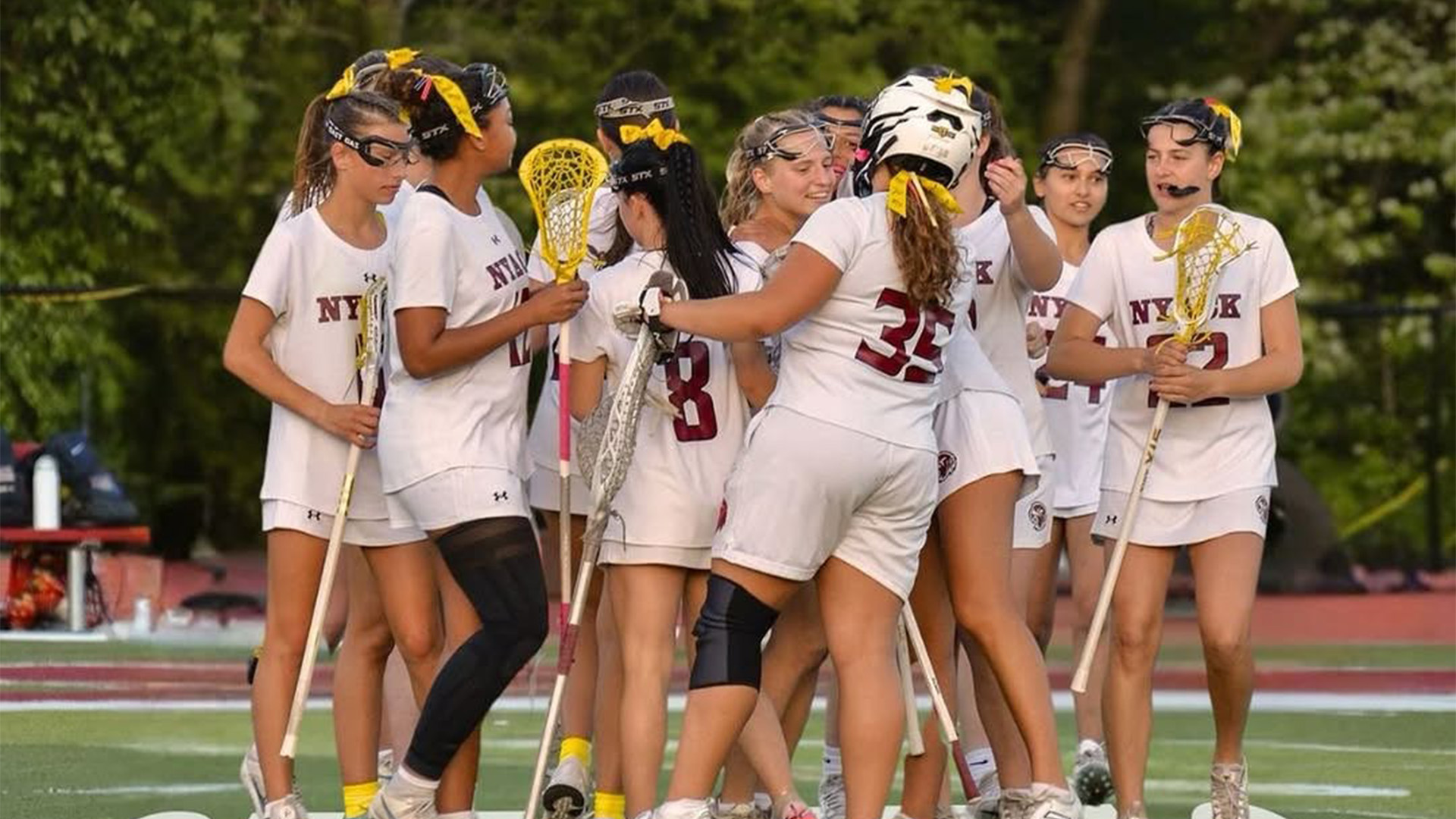 Nyack girls' lacrosse celebration huddle