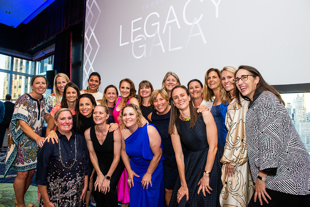 A group of Princeton women's lacrosse alums and supporters pose for a photo