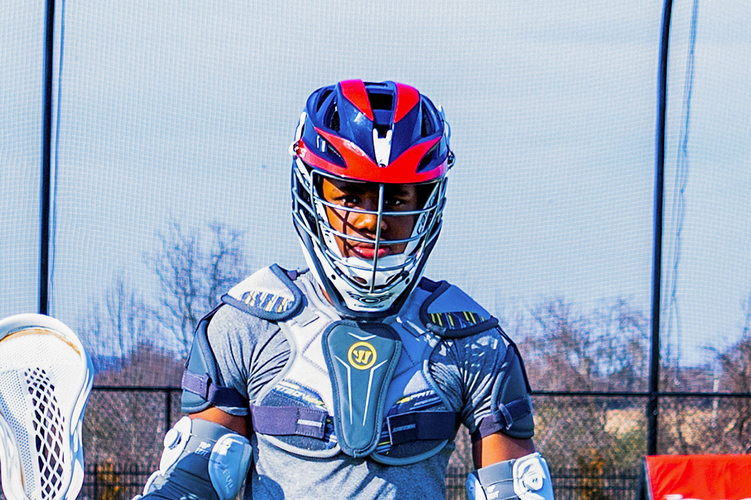 Close up photo of boys' lacrosse player wearing an approved helmet