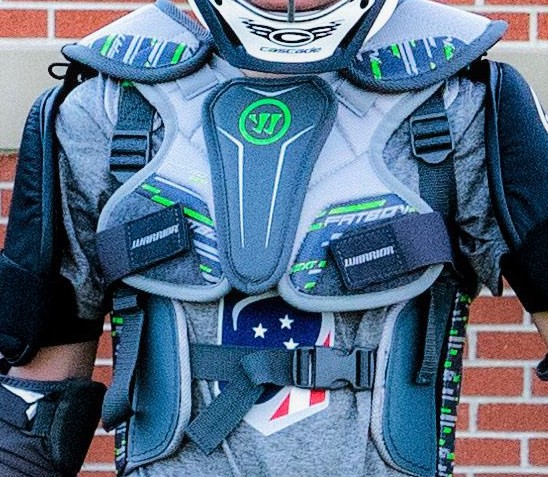 Close up view of a chest protector in boys' lacrosse