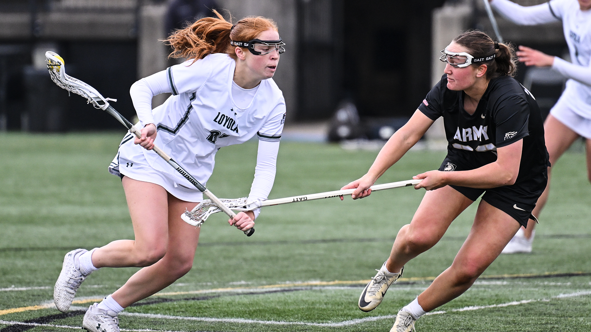 Loyola's Mim Suares-Jury dodges one-on-one against an Army defender