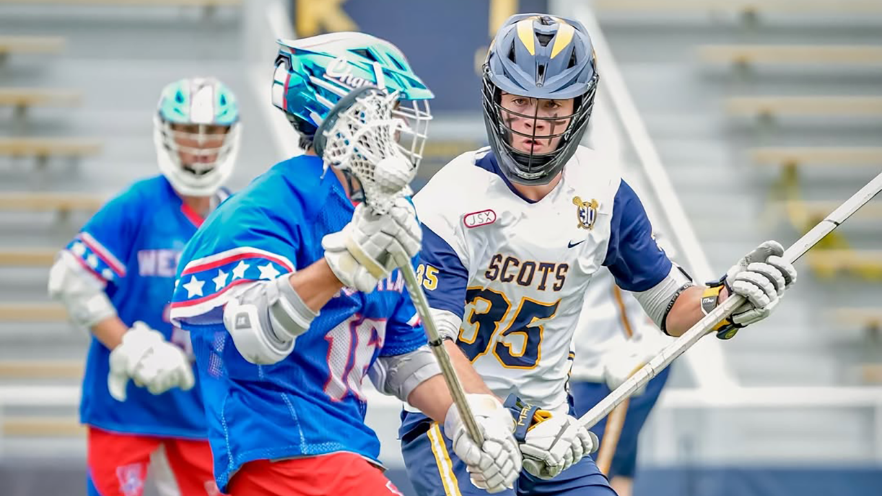 Highland Park (Texas) defenseman guards an attackman from Westlake (Texas)
