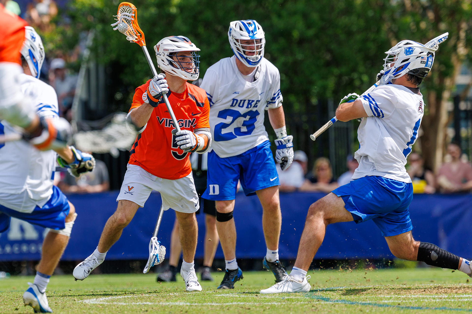 Virginia's Joey Terenzi looks at the goal in close surrounded by Duke players.