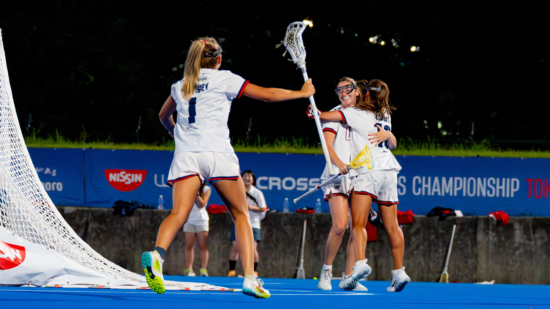 chloe humphrey runs towards sam apuzzo and emma lopinto after a usa goal