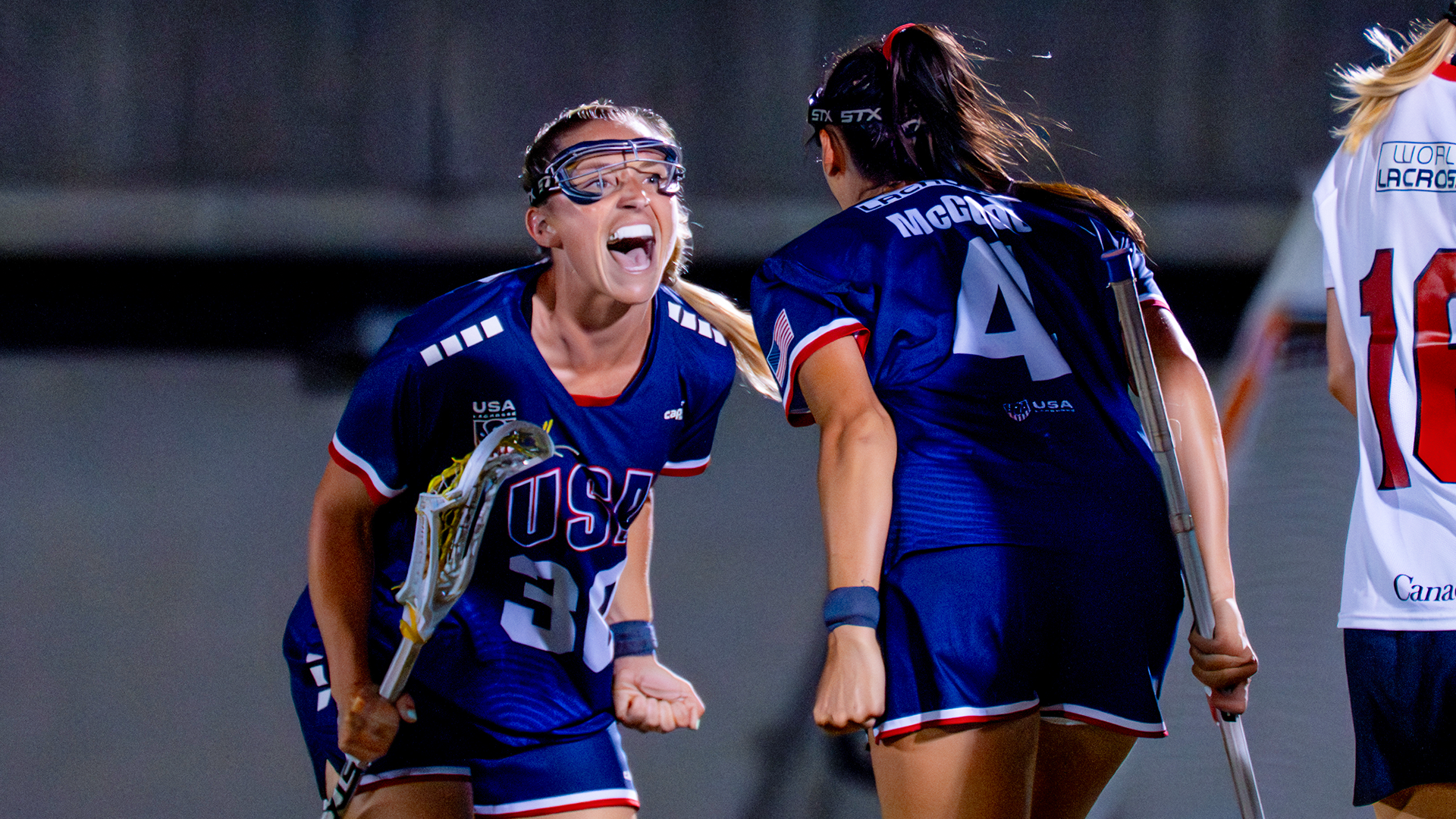 Ally Kennedy and Marie McCool celebrate a goal at the world championship