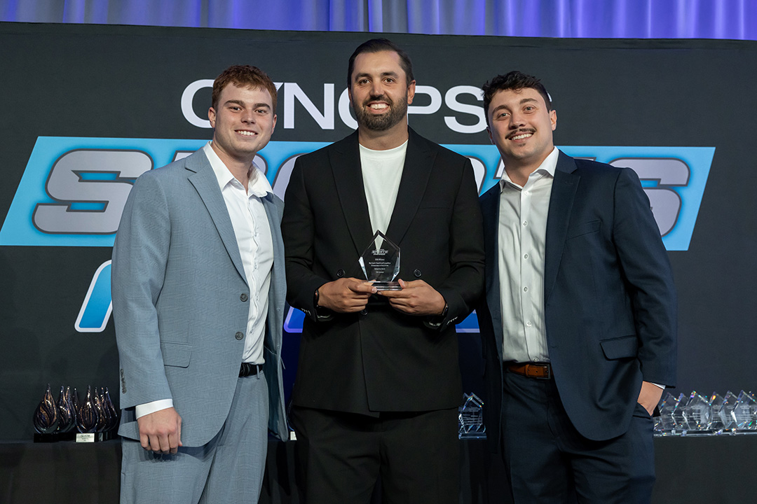 usa lacrosse staff members noah beidelman, dave krupinski and richie garry pose with the Cynopsis Award