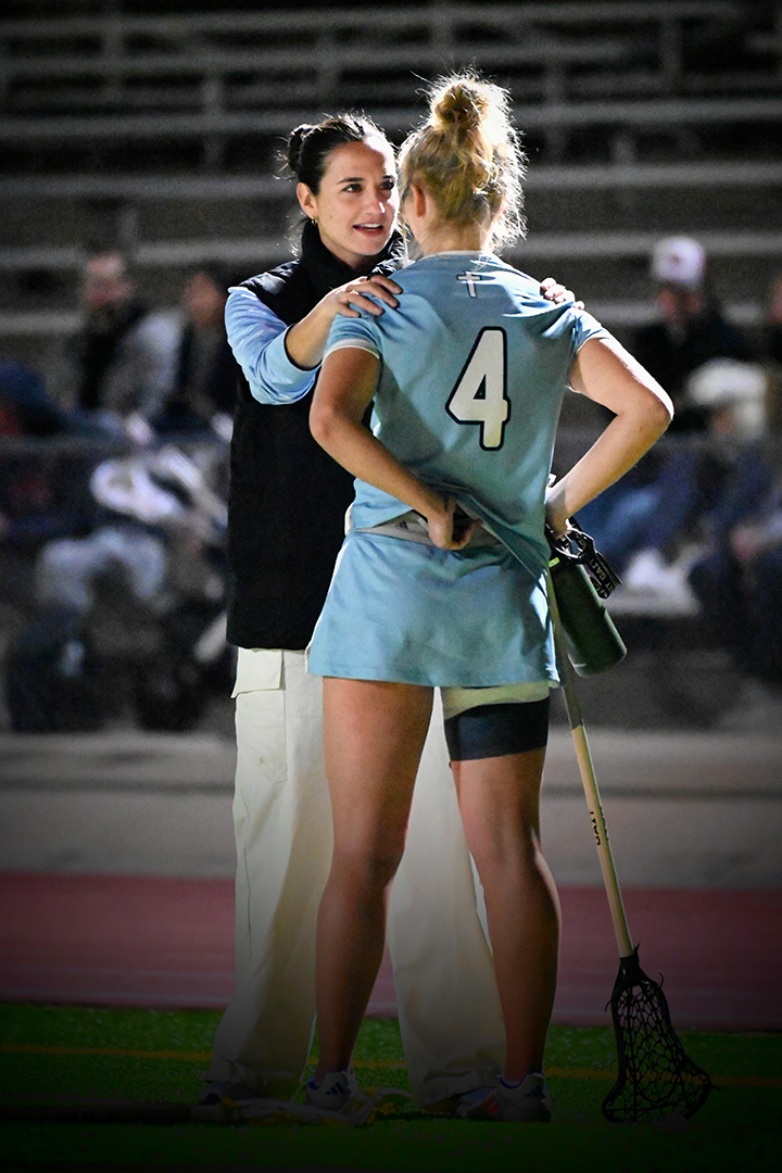Sam Geiersbach talks to one of her players