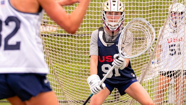 A U.S. Women's U20 goalie prepares to save a shot.