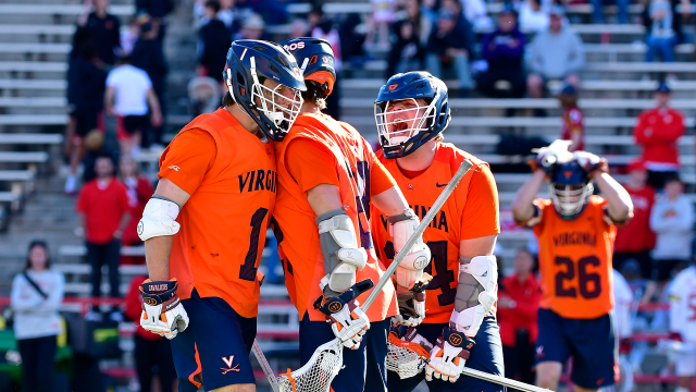 UVA players celebrate with Connor Shellenberger.