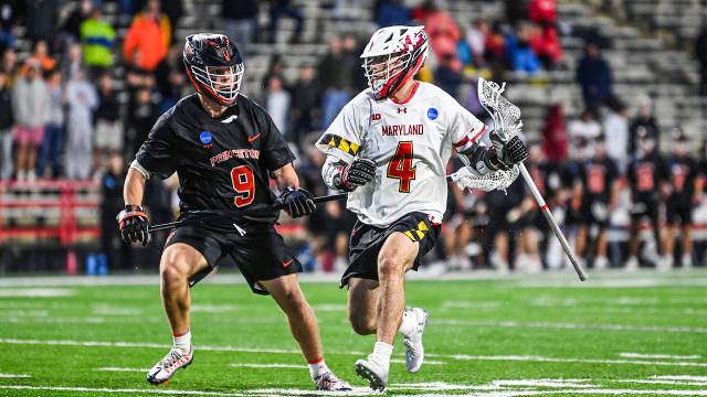 Maryland's Eric Malever dodges against Princeton's Nick Crowley during a 2024 NCAA Division I men's lacrosse tournament first-round game at SECU Stadium.