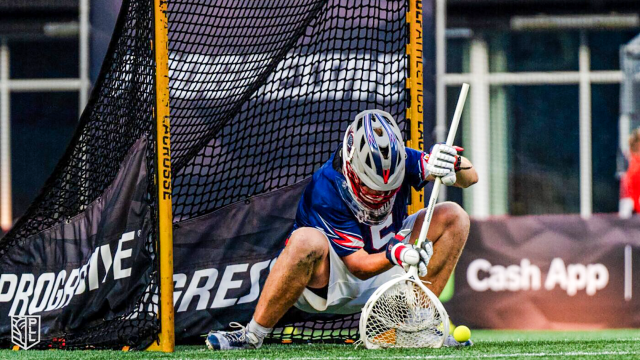 Boston Cannons goalie Connor Kirst saves a low shot in a Premier Lacrosse League game.