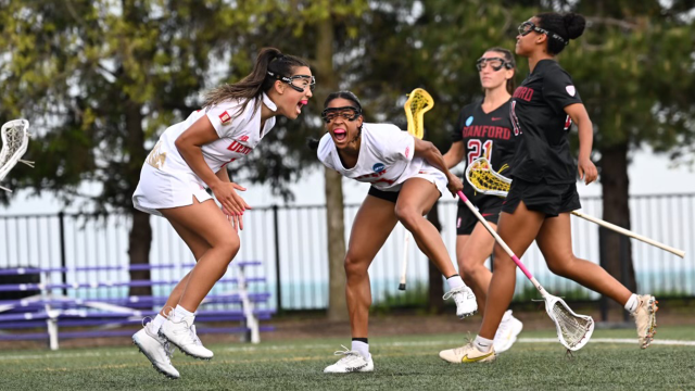 Denver's Lauren Black and Trinity McPherson celebrate a goal.