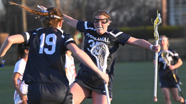 Episcopal (Pa.) girls' lacrosse players celebrate after a goal during a game against McDonogh (Md.) at USA Lacrosse headquarters in Sparks, Md.