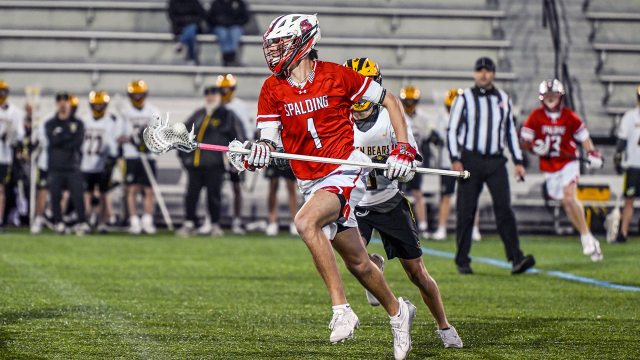 Robby Hopper of Archbishop Spalding (Md.) carries the ball up the field during a game against Upper Arlington (Ohio)