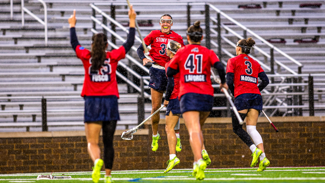 Courtney Maclay celebrates with teammates after one of her six goals in Stony Brook's win over Loyola at Boston College.