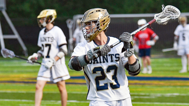 Image of St. Thomas Aquinas (Fla.) boys' lacrosse player Diego Salazar looking to make a pass