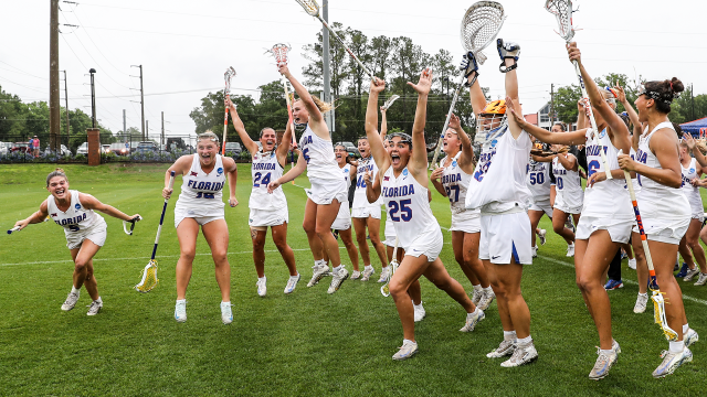 Florida women's lacrosse players celebrate after sealing a double-overtime win over Stanford at Dizney Stadium