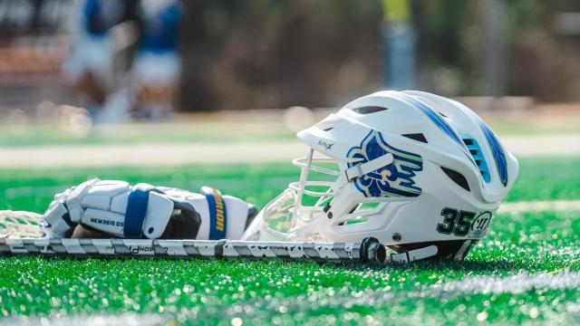 A Limestone lacrosse helmet and glove