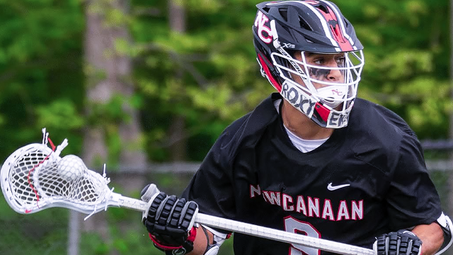 Action image of a New Canaan (Conn.) boys' lacrosse player
