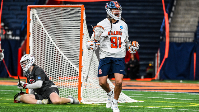Trey Deere roars toward the JMA Wireless Dome crowd after scoring a man-up goal in the fourth quarter of Syracuse's 13-12 OT win over Harvard.