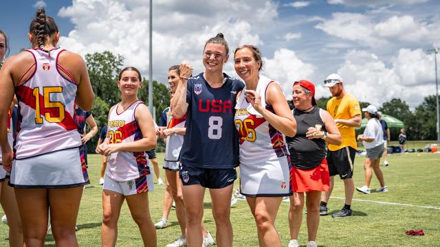 Charlotte North poses for picture with Peru national team lacrosse players