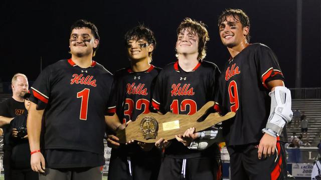 Half Hollow Hills players celebrate their title with the trophy