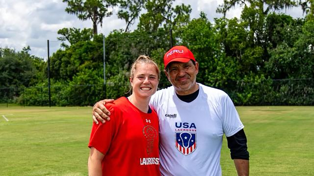 Izzy Scane poses following a t-shirt swap after the USA's first-ever game against Peru
