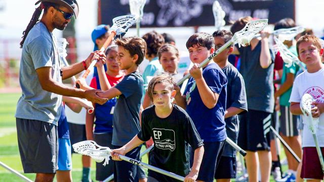 Youth lacrosse players participate in a USA Lacrosse clinic in El Paso, Texas