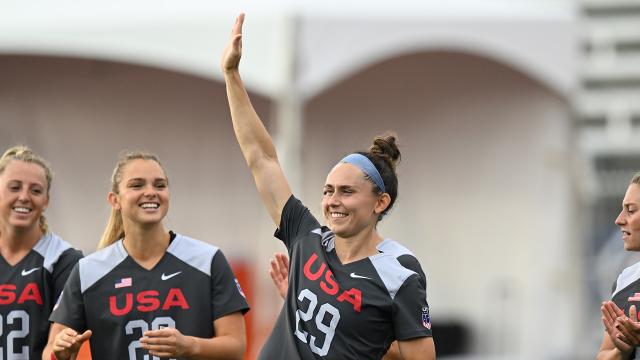 Megan Douty waves to the crowd ahead of a game at the 2022 World Lacrosse Women's Championship in Towson, Maryland.