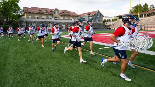 USA U20 lacrosse players run onto the field at a training camp at Cornell University